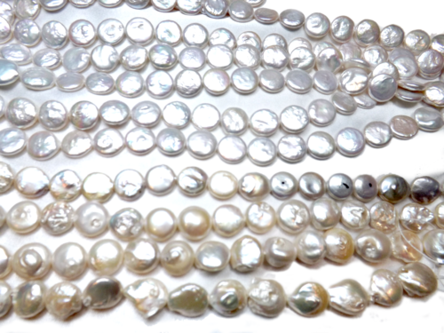 different graded white coin pearl strands