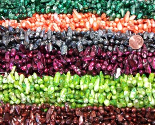 white, cranberry, green, grey and pink all colored pearl strands
