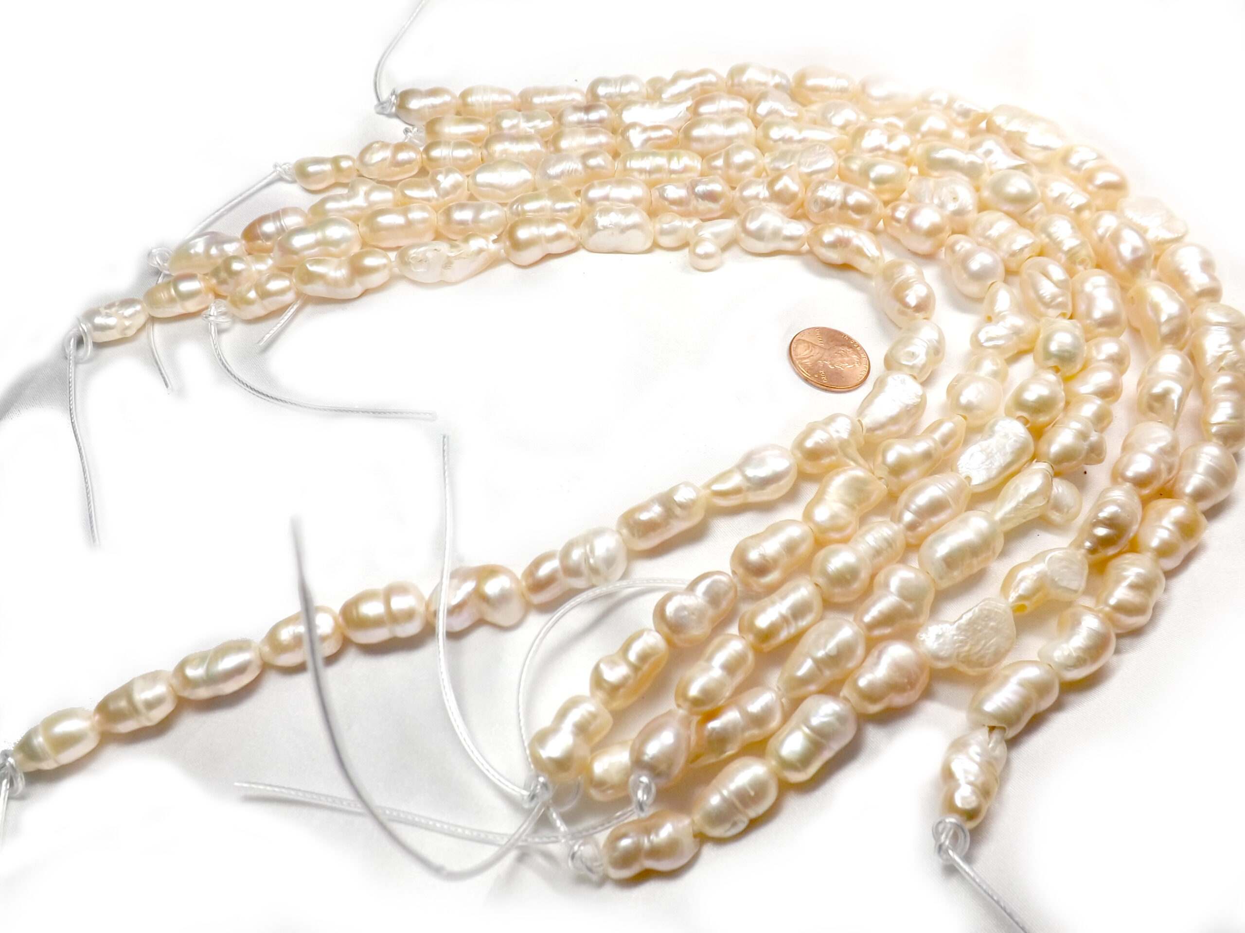 Length Drilled pink colored peanut pearl strands drilled 2.5mm holes