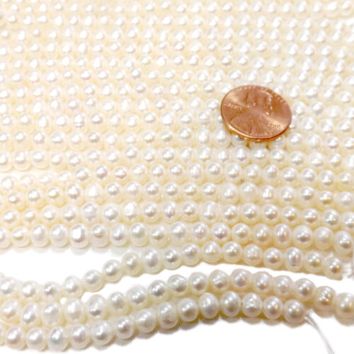 4-5mm semi-round pearl strands drilled with 0.9mm holes