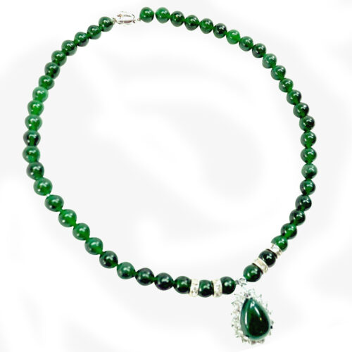 green jade necklace with pendant and a sterling silver pendant