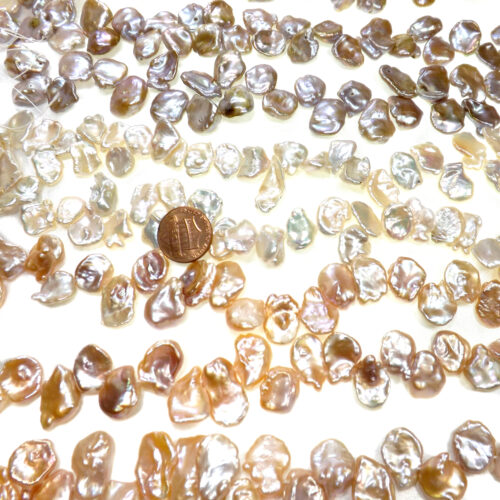 Huge Sized super high luster white pink or mauve keshi freshwater pearl strand rare