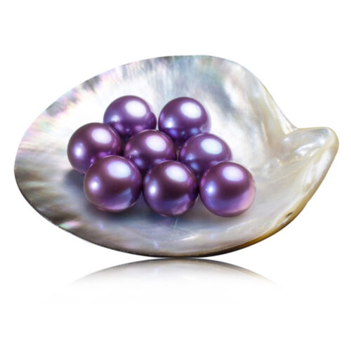 loose individual pearls in mauve color