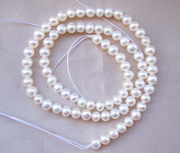 White 5-6mm Semi-Round Pearl Strands
