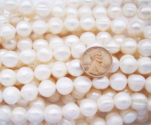 White 10-11mm Side Drilled Semi-Round Pearl Strands with Natural Dents