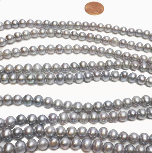 grey colored semi round pearl strand